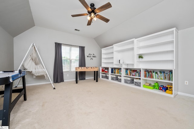 playroom with baseboards, visible vents, carpet, lofted ceiling, and a ceiling fan