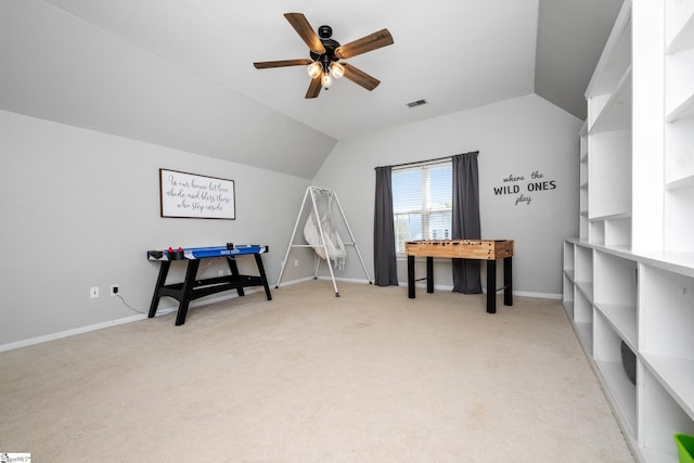 game room featuring light carpet, vaulted ceiling, and visible vents