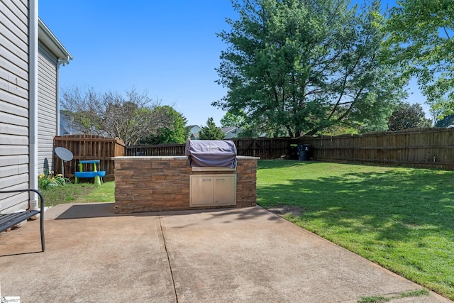view of patio featuring a grill, a fenced backyard, and area for grilling