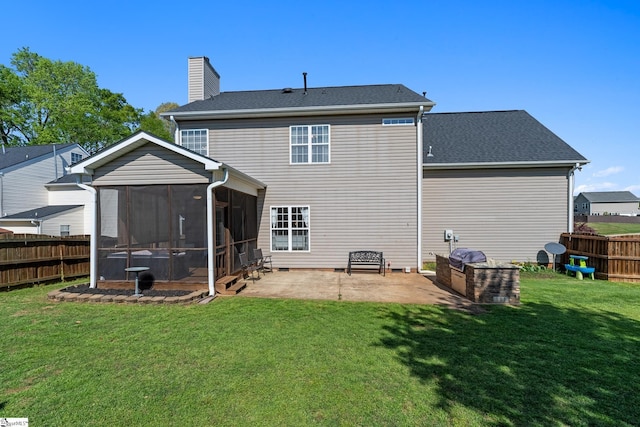rear view of property featuring a chimney, a fenced backyard, a patio, a lawn, and a sunroom