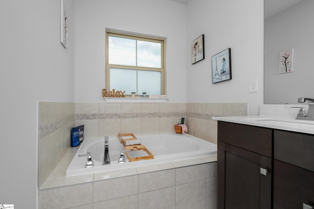 full bath with a garden tub and vanity