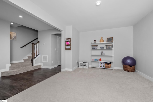 exercise area featuring baseboards, visible vents, carpet, and recessed lighting