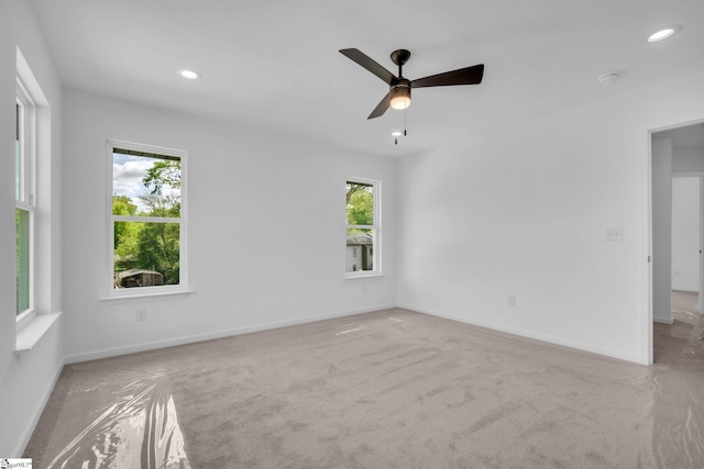 spare room featuring baseboards, carpet floors, and recessed lighting