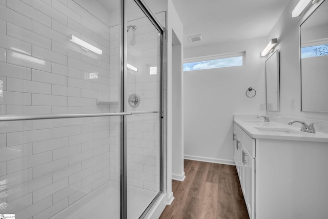 full bath featuring a shower stall, visible vents, and a sink