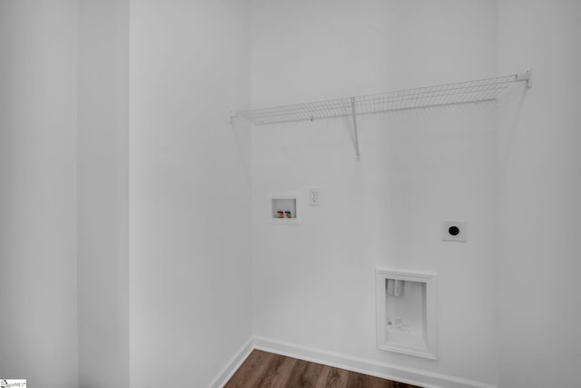 laundry room featuring dark wood-style flooring, baseboards, washer hookup, electric dryer hookup, and laundry area