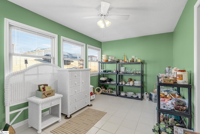 interior space featuring ceiling fan