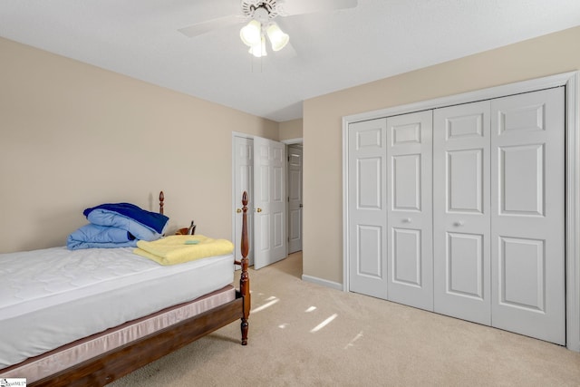 carpeted bedroom with a ceiling fan