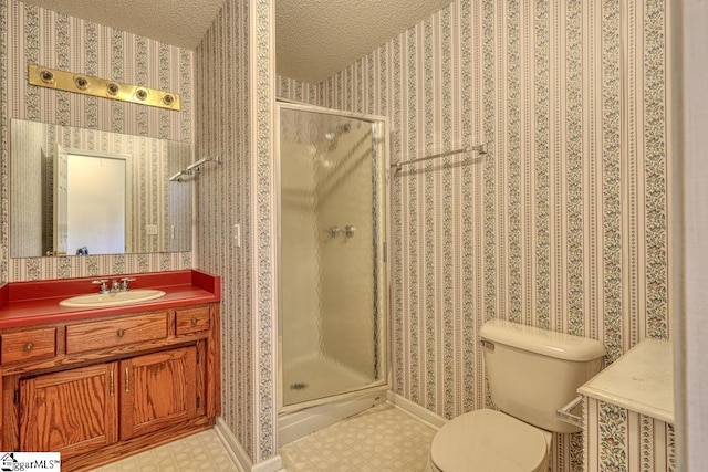 125 N River Hills Dr, Spartanburg, SC 29303 - bathroom with toilet, vanity, baseboards, a textured ceiling, and a stall shower