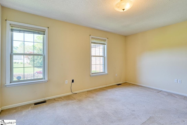 125 N River Hills Dr, Spartanburg, SC 29303 - carpeted spare room with baseboards, visible vents, and a textured ceiling