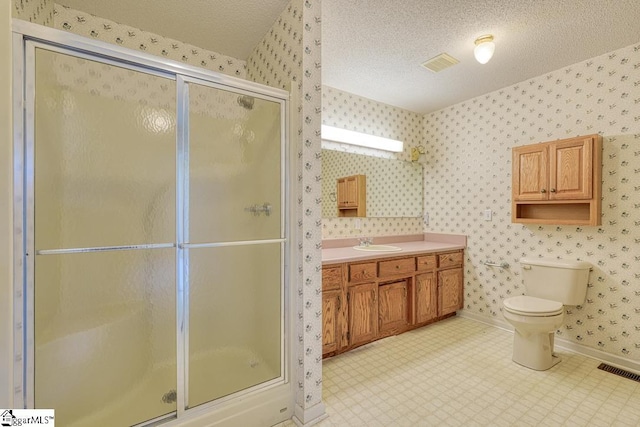 125 N River Hills Dr, Spartanburg, SC 29303 - bathroom with a shower stall, toilet, wallpapered walls, and visible vents