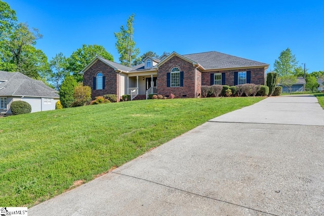 125 N River Hills Dr, Spartanburg, SC 29303 - single story home featuring brick siding, covered porch, a front lawn, and concrete driveway