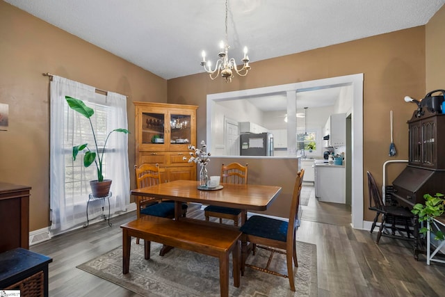 408 S 2nd St, Easley, SC 29640 - dining room featuring an inviting chandelier, wood finished floors, and baseboards