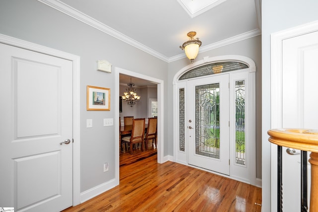 127 Warren Dr, Easley, SC 29640 - foyer featuring baseboards, ornamental molding, a chandelier, and light wood-style flooring
