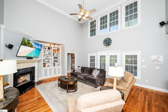 127 Warren Dr, Easley, SC 29640 - living area with a high ceiling, wood finished floors, a ceiling fan, ornamental molding, and baseboards