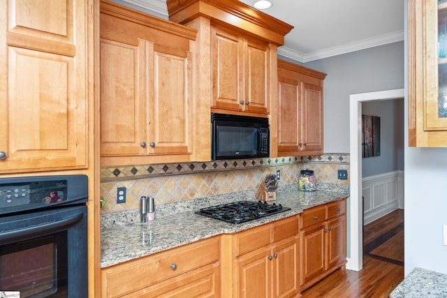 127 Warren Dr, Easley, SC 29640 - kitchen featuring backsplash, wood finished floors, black appliances, light stone countertops, and ornamental molding