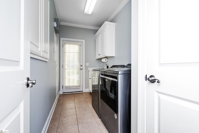 127 Warren Dr, Easley, SC 29640 - washroom featuring ornamental molding, light tile patterned flooring, independent washer and dryer, baseboards, and cabinet space