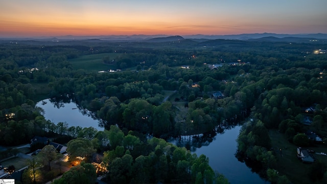 127 Warren Dr, Easley, SC 29640 - aerial view at dusk featuring a wooded view and a water and mountain view