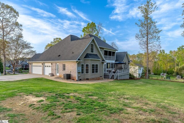127 Warren Dr, Easley, SC 29640 - rear view of house featuring cooling unit, an attached garage, crawl space, driveway, and a lawn