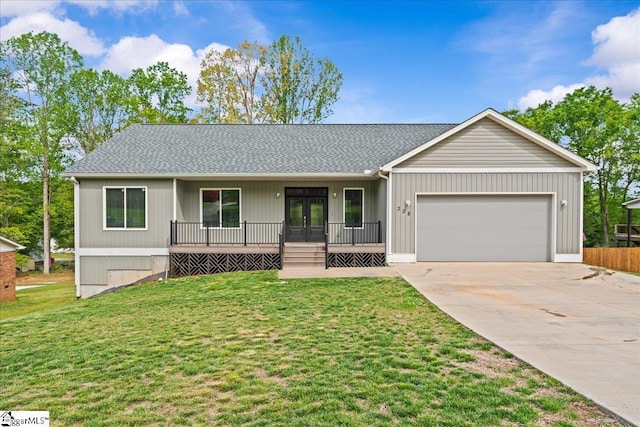 308 Pineridge Dr, Spartanburg, SC 29303 - ranch-style home featuring a front lawn, driveway, french doors, a porch, and a garage