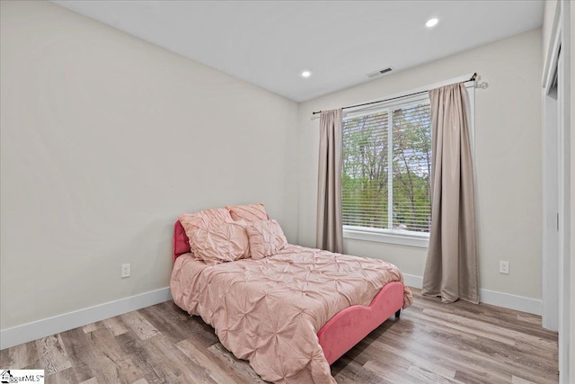 308 Pineridge Dr, Spartanburg, SC 29303 - bedroom with wood finished floors, baseboards, and multiple windows