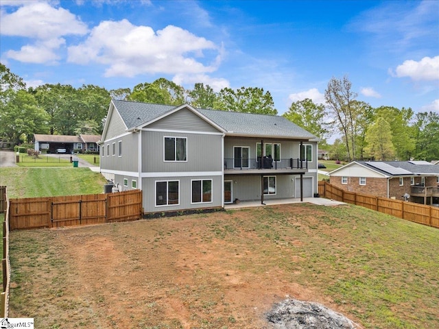308 Pineridge Dr, Spartanburg, SC 29303 - rear view of property with a fenced backyard, an attached garage, a lawn, a balcony, and a patio