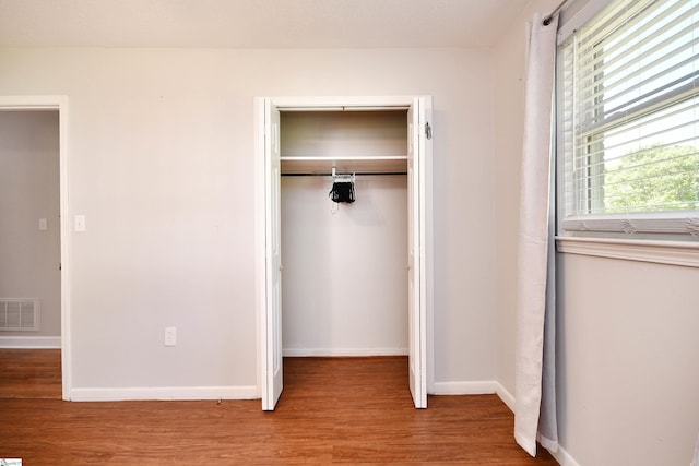 105 Ridgeland Cir, Easley, SC 29640 - unfurnished bedroom featuring baseboards, wood finished floors, visible vents, and a closet