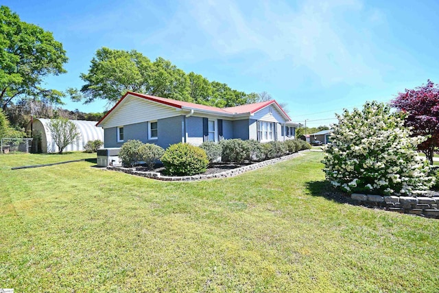 105 Ridgeland Cir, Easley, SC 29640 - view of property exterior featuring a lawn, brick siding, and fence