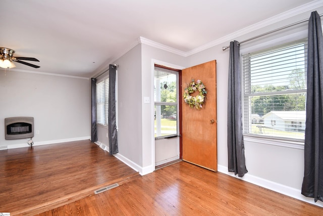 105 Ridgeland Cir, Easley, SC 29640 - entryway with heating unit, visible vents, crown molding, baseboards, and light wood-style flooring