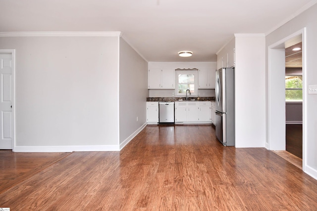 105 Ridgeland Cir, Easley, SC 29640 - kitchen with white cabinets, dark wood-style floors, dark countertops, a healthy amount of sunlight, and appliances with stainless steel finishes