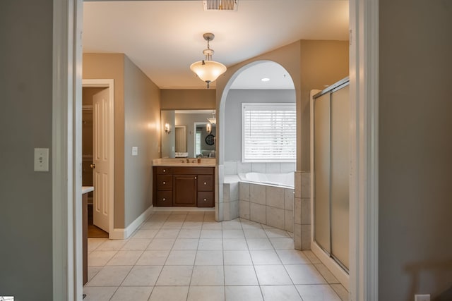 full bath with visible vents, tile patterned flooring, a shower stall, a garden tub, and vanity