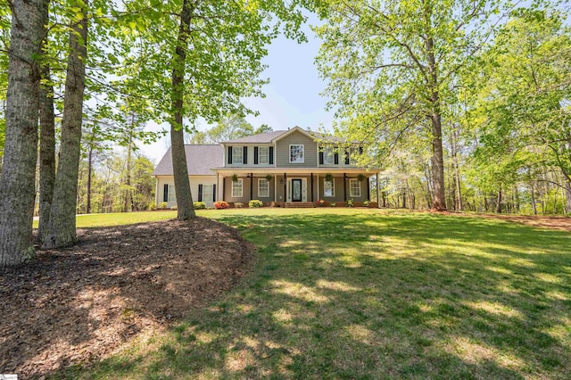 view of front of house with a porch and a front lawn