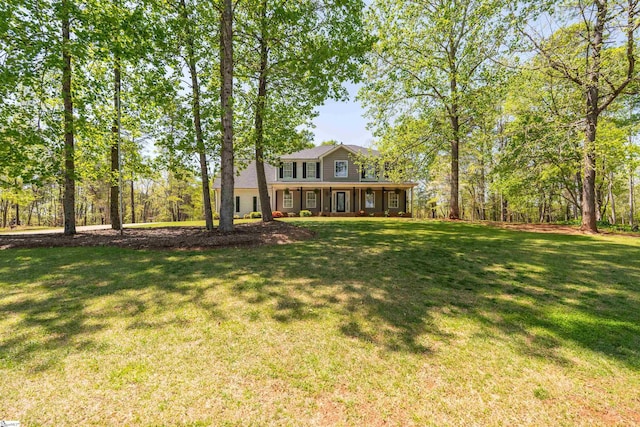 view of yard featuring covered porch