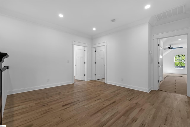 unfurnished bedroom with recessed lighting, wood finished floors, visible vents, crown molding, and baseboards