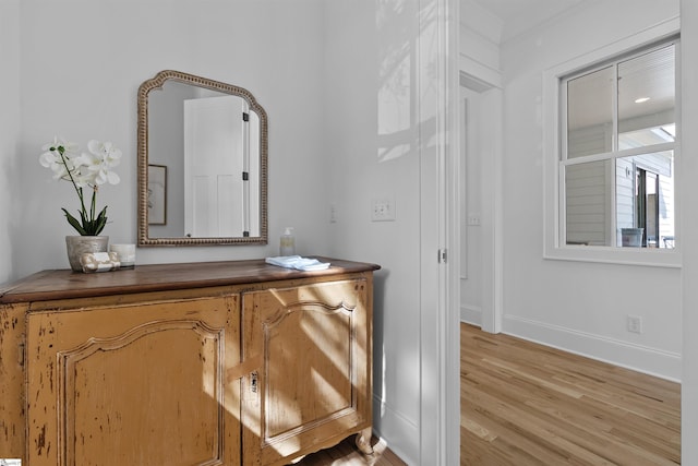 interior space featuring wood finished floors and baseboards