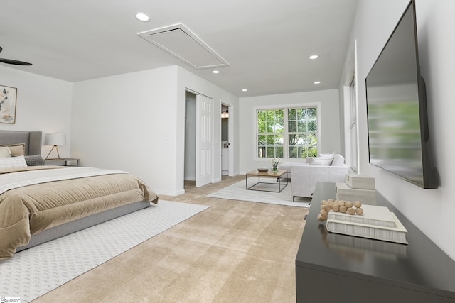 carpeted bedroom featuring attic access and recessed lighting