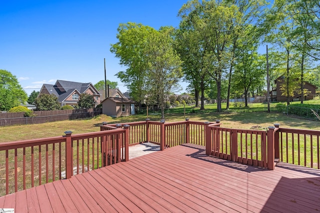 deck featuring a lawn and a fenced backyard