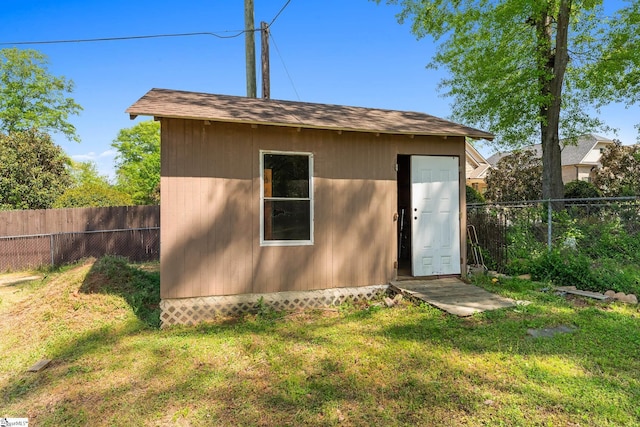 view of shed with a fenced backyard