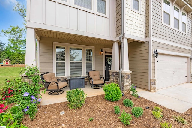 204 Lambert Ct, Simpsonville, SC 29680 - doorway to property with board and batten siding, an attached garage, a porch, and stone siding