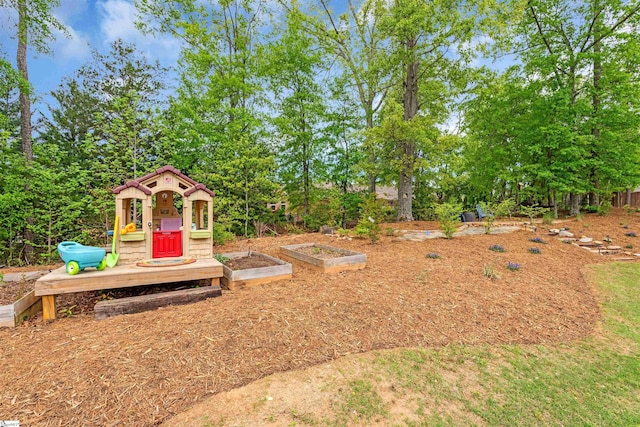 204 Lambert Ct, Simpsonville, SC 29680 - view of yard with an outbuilding and a vegetable garden