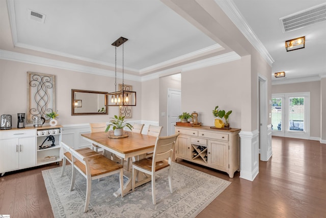 204 Lambert Ct, Simpsonville, SC 29680 - dining room featuring a tray ceiling, visible vents, hardwood / wood-style flooring, and ornamental molding
