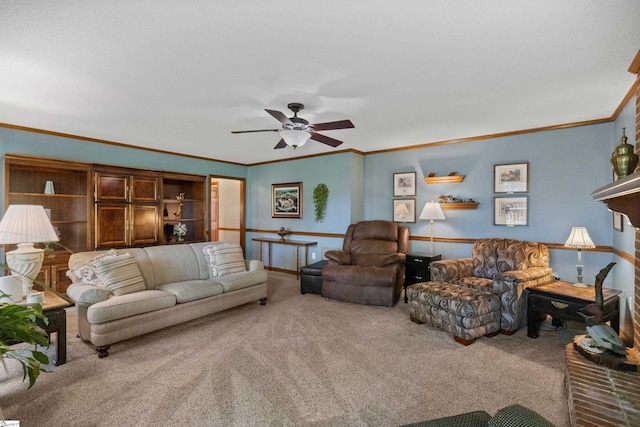 living room featuring carpet floors, ceiling fan, and crown molding