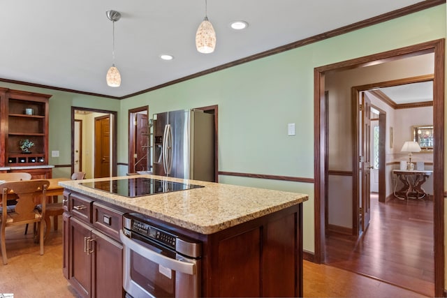 kitchen with recessed lighting, stainless steel appliances, light stone countertops, crown molding, and hanging light fixtures