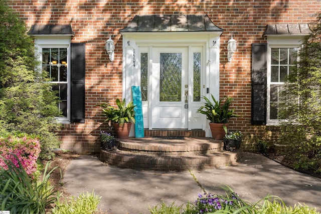 property entrance with brick siding