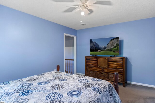 carpeted bedroom with baseboards and a ceiling fan