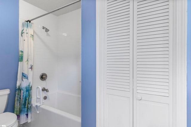 full bathroom featuring shower / tub combo, a closet, and toilet