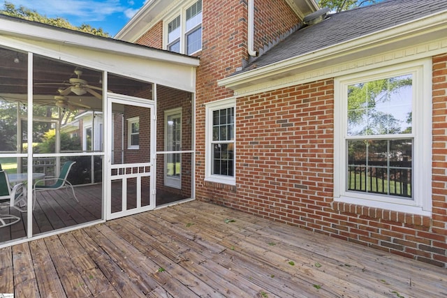 wooden deck featuring a sunroom