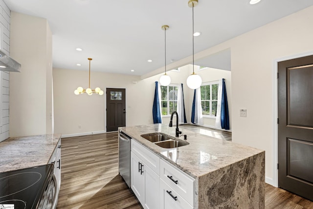 kitchen featuring white cabinets, stainless steel dishwasher, recessed lighting, and a sink