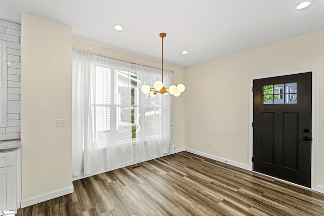 entryway with recessed lighting, wood finished floors, and baseboards