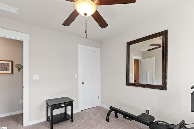 workout area with carpet floors, visible vents, baseboards, and ceiling fan