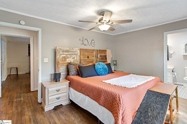 bedroom with a textured ceiling, baseboards, wood finished floors, ceiling fan, and ornamental molding